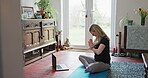 Yoga, laptop and live streaming with woman in living room for online class, social media and learning. Workout, meditation and peace with person and video call at home for spiritual and mindfulness