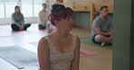 Fitness, yoga and a woman in a class for health, wellness or awareness of inner peace and balance. Zen, exercise or pilates training with a mature female yogi waiting to start her holistic workout