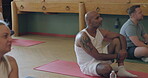 Yoga, wellness and group of people in a class to listen, exercise or fitness. Holistic, chakra and relax with men and women together for mindfulness, learning and healing or zen talk with peace