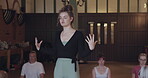 Yoga, coaching and teacher with woman in studio for meditation, health and workout. Wellness, spiritual and exercise with group of people in class for pilates, mindfulness and holistic healing