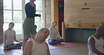 Yoga, coaching and stretching with teacher in studio for meditation, health and workout. Wellness, spiritual and exercise with group of people in class for pilates, mindfulness and holistic healing