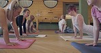 Yoga class, stretching and fitness group with cobra exercise for health and wellness. Women and men together at zen training club for mindfulness, workout and balance or relax with instructor on mat