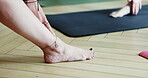 Coach, closeup floor and feet for a yoga class for peace, fitness and stretching together. Teaching, team and people at the gym for pilates, workout or exercise for wellness, training or relax