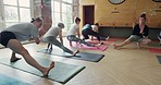 Yoga class, health and group doing pilates exercise in a zen studio for mind, body and chakra balance. Calm, meditation and people stretching for wellness, fitness and self care workout in a gym.