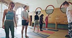 Yoga class, calm and people with teacher in studio for mind, body and fitness workout for chakra. Peace, calm and group of meditation students in position for pilates exercise in zen health studio.