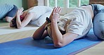 Yoga class, wellness and people stretching in gym for mind, body and fitness for chakra. Peace, calm and group of meditation students in position for pilates exercise or workout in zen health studio.