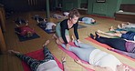 Yoga, balance and coach helping woman with posture for a body, mind and breathing exercise. Wellness, zen and meditation teacher with a calm female person in a pilates class in a workout studio.