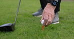 Hands, golf club and ball or tee, training and competition on grass, challenge and tournament. Person, athlete and ready for sports, practice and hobby or recreation, action and equipment for match