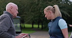 People, coaching and sports or lesson, golf and smile or positive mindset for match. Senior man, woman and conversation and discussion in outdoors, course and tournament or laughing for competition