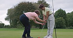 Golf, coach and woman training for sport on course for development in stroke or swing of club. Teaching, hands or mentor help golfer with stick or athlete learning to hit ball on pitch in sports game