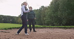 Golf, training and women on course together for coaching, teaching and fun game. Tee off, bunker and woman with professional instructor, swing and support for motivation, competition and challenge.