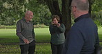 Retirement, talking and a senior friends on a golf course for help or to explain a shot technique to a player. Fitness, hobby or golfing with an elderly man and woman speaking outdoor on a green