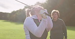 Golf, training and women on grass together for coaching, teaching and fun game. Tee off, green course and woman with professional instructor, swing and support for learning, competition and challenge