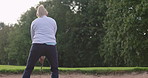 Sports, back and woman with golf stroke, game and outdoor with fitness, exercise and training. Person, golfer or athlete with practice, swing or workout on a green course with cardio, health or relax
