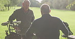 Friends, golf course and senior man in wheelchair to play game, training and competition for recreation. Sports, golfer and person with disability with golfing club, ball and stroke for fun hobby