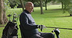 Play, golf and man in a wheelchair with game on lawn, grass field or course with club. Sports, friends and person with a disability in summer, countryside or nature with exercise, training or health