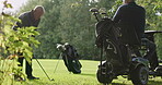 Golfers, golf course and golfing with friends, sports and cart for fitness, athlete and practice. Club, grass and lawn for training, outdoor and recreation for hobby, playing and game equipment
