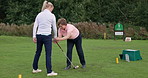 Sport, coach and training woman golf with club, stroke and hands on stick at course on grass field and lawn. Personal trainer, teaching or person with help, support and guide athlete to play in game