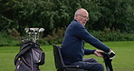 Play, golf and man in a wheelchair with game on lawn, grass field or drive scooter on course. Sports, club and person with a disability in summer, countryside or outdoor in nature for exercise
