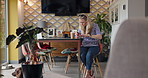 Woman, blow nail polish and color with manicure, makeup and cosmetics with dog, self care and desk. Person, grooming and painting fingernails with style for change, relax and choice on table in house