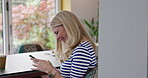 Woman, cellphone and typing in home for funny conversation, social media post or online connection. Female person, mobile and smile in morning for network meme or internet comedy, reading or chat