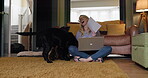 Businesswoman, sitting on floor and laptop with dogs, work from home and pets disturbing her, playful and happy. Freelancer, living room and tech for career, silly and animals to keep her company