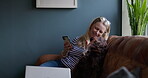 Woman, cellphone and texting or dog on sofa in home for love pet or online, talking or freelance work. Female person, animal and affection owner on couch or network job chat, loyalty or relax morning