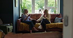 Coffee cup, relax friends and women conversation, talking and speaking in morning chat, communication or discussion. Pet dog, living room sofa and home people consulting, gossip and drink green tea