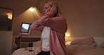 Night, stress or frustration and a woman in the bedroom of her home feeling exhausted with insomnia. Face, mental health or pressure and a tired or sleepless person sitting on a bed in an apartment