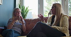 Home, friends conversation and women listen to discussion, communication and consulting on story, news or gossip. Living room couch, morning wellness and people relax, leisure and talking together