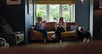 Tea cup, talking friends and women listen to conversation, discussion and consulting on story. Living room couch, sitting together and home people share gossip news, secret and drink coffee beverage