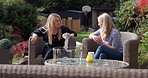 Backyard, women and friends with conversation, relax and bonding together with happiness, nature and communication. Ladies, outdoor and people with discussion, summer break and speaking with sunshine