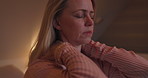 Night, stress or depression and a woman in the bedroom of her home feeling exhausted with insomnia. Face, mental health or anxiety and a tired or sleepless person sitting on a bed in an apartment