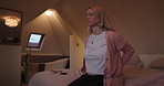 Woman, back pain and injury on bed in bedroom with osteoporosis, spine problem or medical risk at home. Healthcare, person and eyes closed with backache or discomfort from bad posture or tension