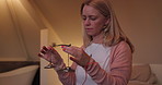 Home, Tibetan bells and woman with peace, healing and meditation with health, wellness and calming. Person, apartment or lady with Buddhist ritual, culture or energy with religion, relax or vibration