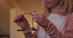 Tibetan bells, woman and yoga with peace, calm or meditation practice with routine, sound or stress relief. Home, person or yogi with Buddhism believe, relaxed mind or tingsha with prayer or wellness