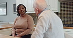 Conversation, kitchen and caregiver with senior man for talking, communication and chat. Retirement home, assisted living and black woman with elderly patient for bonding, support and medical service