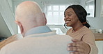 Woman, nurse and caregiver with senior patient in support, help or care at old age home. Calm female person, volunteer and elderly man talking in medical aid, health or assistance at retirement house