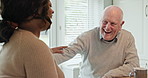 Senior couple, laugh and happy in kitchen, home and conversation for love, relax and enjoy. Retirement, old age and elderly in house, bonding together and quality time for discussion, man and woman
