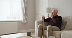 Old man, walking stick and thinking in home on sofa with alzheimer, dementia or lonely in retirement. Elderly, depression or senior person with disability in house and mental health stress or anxiety