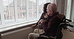 Nurse, senior man on wheelchair at window or support, healthcare or help, medical assistance or rehabilitation. Caregiver, elderly person with a disability or conversation in retirement home for view