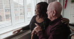 Caregiver, senior man on wheelchair at window and support, healthcare or help in rehabilitation. Happy nurse, elderly person with a disability and conversation in retirement home, pointing at view