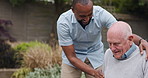 Wheelchair, outdoor and nurse with old man, support and recovery with rehabilitation, wellness and healing. Pensioner, person with a disability and caregiver with helping, outside and healthcare