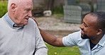 Support, conversation and old man with caregiver at park, garden or outdoor. Elderly person with a disability, talk to nurse and rehabilitation, healthcare or medical assistance, smile and wellness