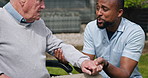 Wheelchair, outdoor and nurse with old man, recovery and healing with rehabilitation, holding hands and support. Pensioner, person with a disability and caregiver with medical service and healthcare