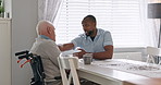 Nurse, support and old man in a wheelchair talking with respect and advice for healthcare in retirement. Elderly, caregiver and person with a disability or help with kindness or chat on coffee break