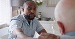 Nursing home, conversation and caregiver with senior man in a kitchen for empathy, comfort or hope. Homecare, help and African male nurse with old patient in a house with support, kindness or advice