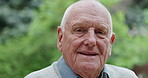 Face, outdoor and senior man with a smile, retirement and Canada with happiness, nature or wellness. Portrait, pensioner or elderly person with gratitude, peace or calm in the garden, cheerful or joy