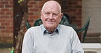Relax, backyard and face of senior man for calm, fresh air and wellness outdoors in home. Retirement, nature and portrait of elderly person smile sitting in backyard for freedom, thinking and peace