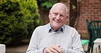 Happy senior man, wheelchair and smile in garden, relax or retirement outside old age home. Portrait of elderly, mature male or person with a disability enjoying natural outdoor or fresh air at house